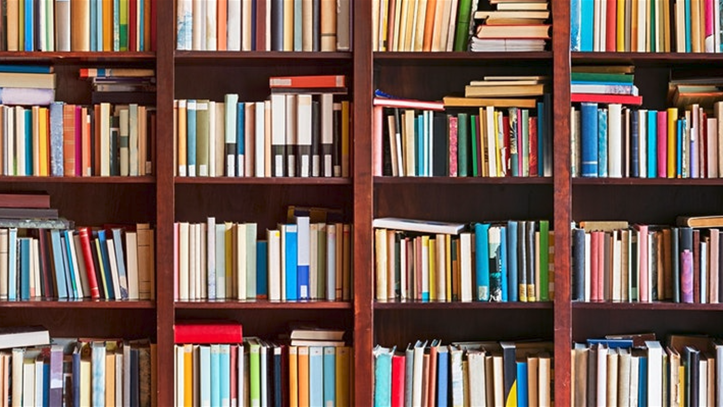 A photo of bookshelves filled with books.