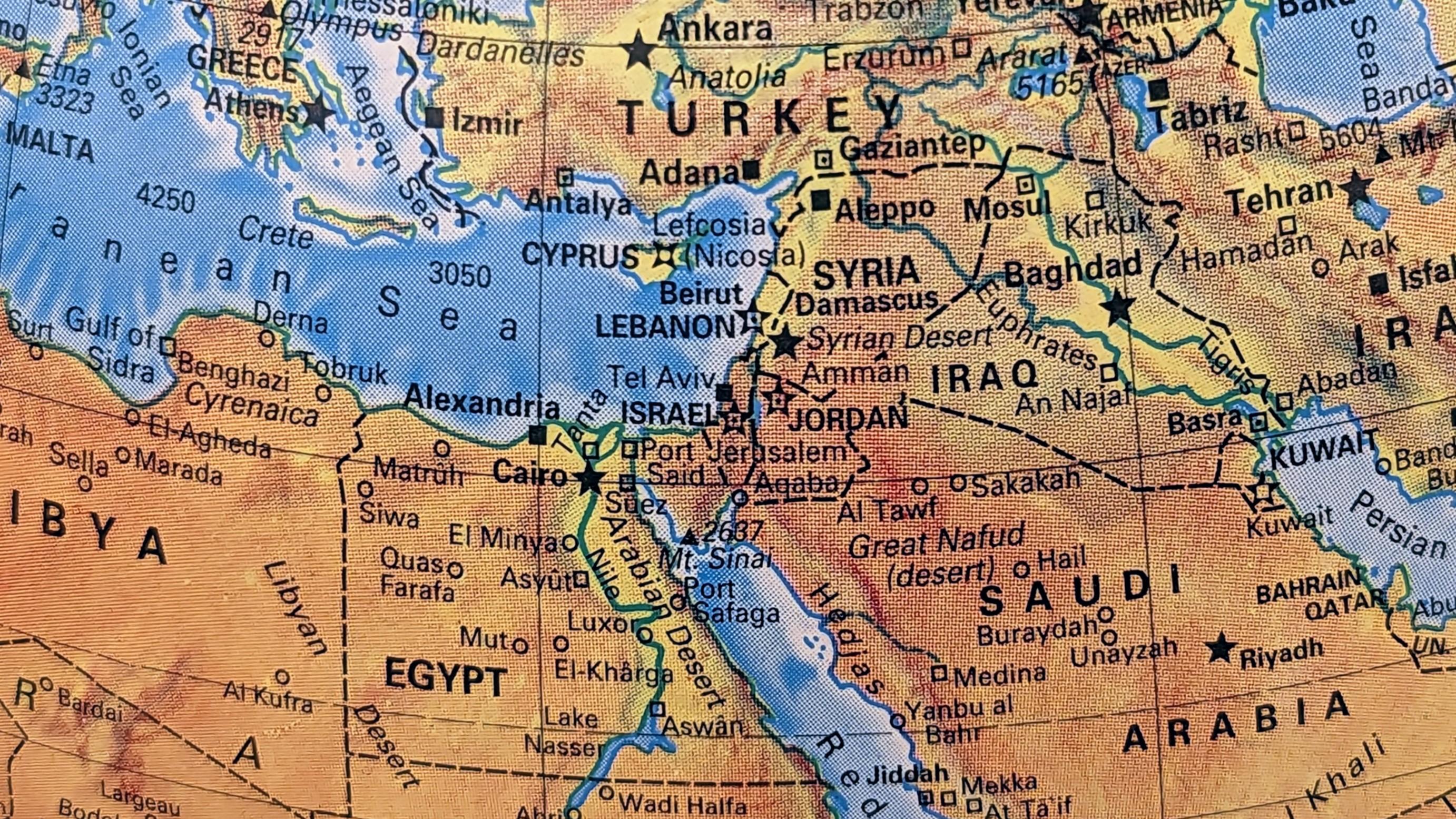 A photograph of the Middle East on an old globe.