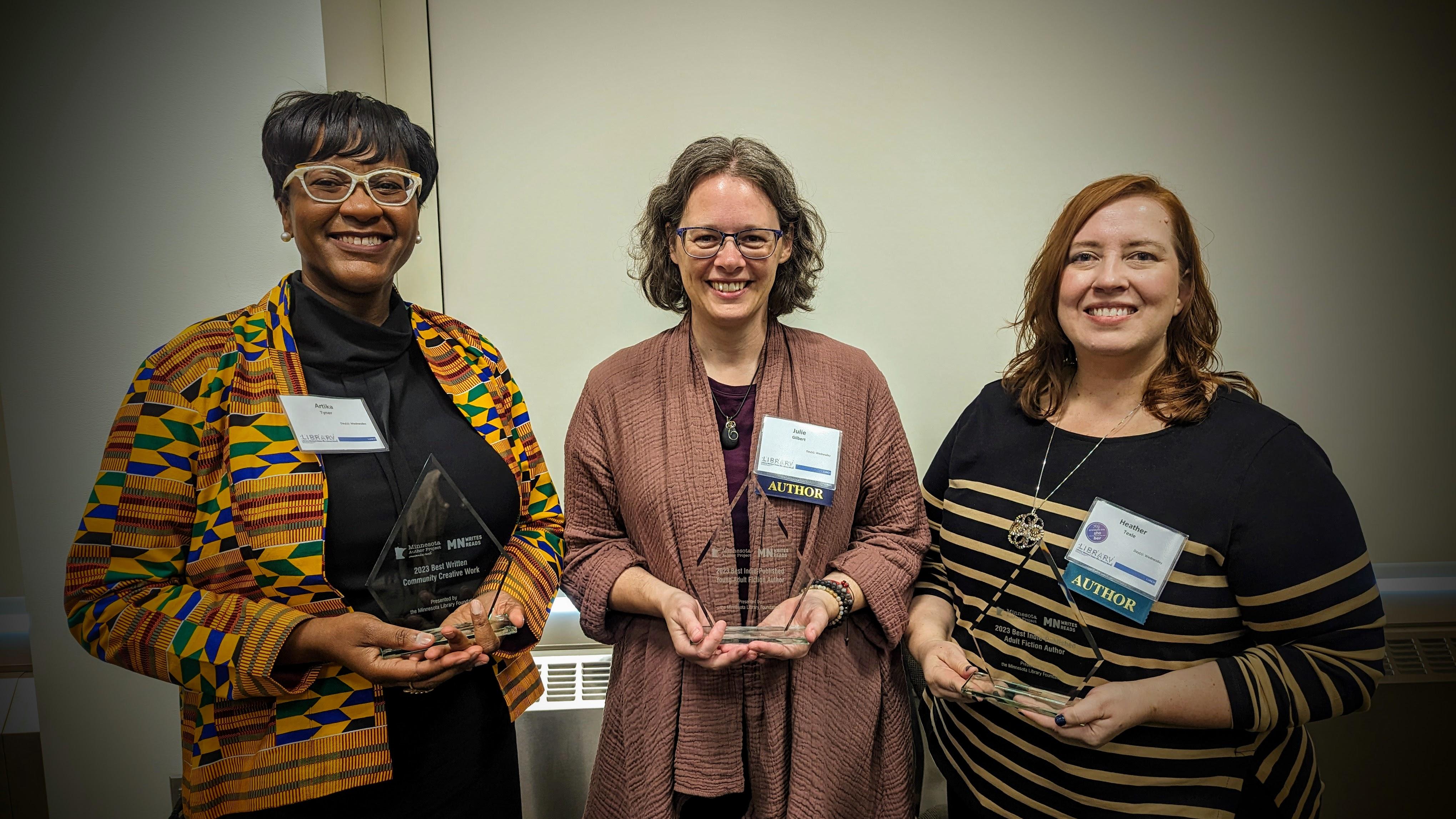 Artika Tyner, Julie Gilbert, and Heather Texle pose with their Minnesota Author Project awards.