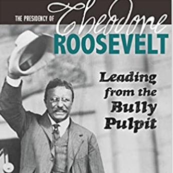 Theodore Roosevelt raising his hat while campaigning