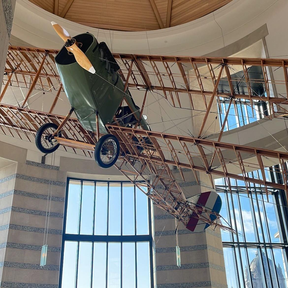 A photo of an old-school model plane hanging at the Minnesota History Center.